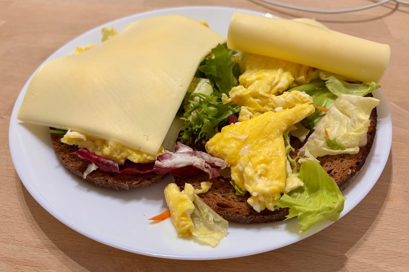 My daily breakfast: Bread with scrambled eggs and a slice of Gouda